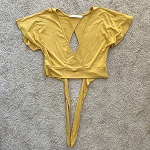 Yellow crop top, ties in the back